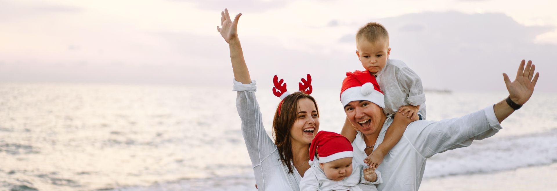 Family On The Beach Celebrating Christmas