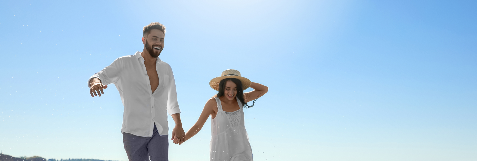 A Young Couple On The Beach