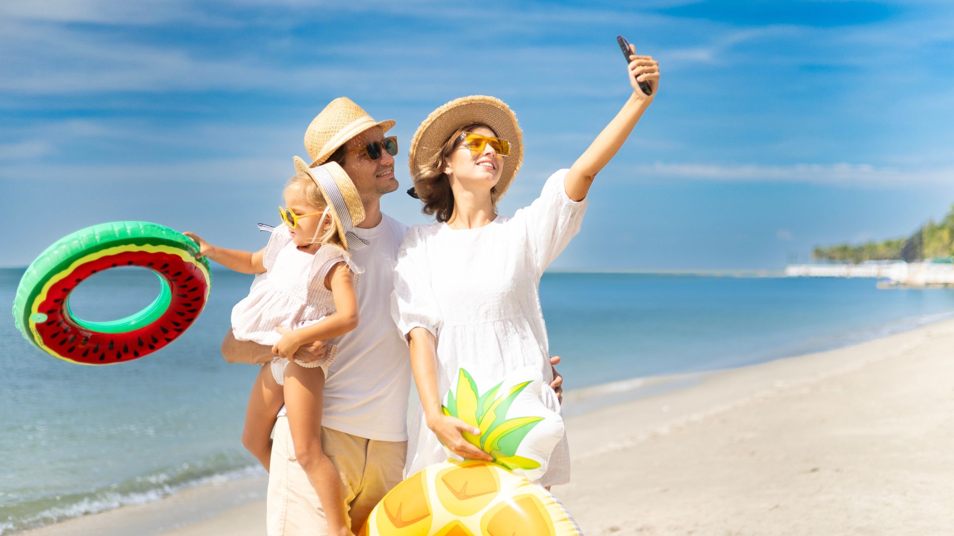 Family Vacation At The Beach With Inflatables
