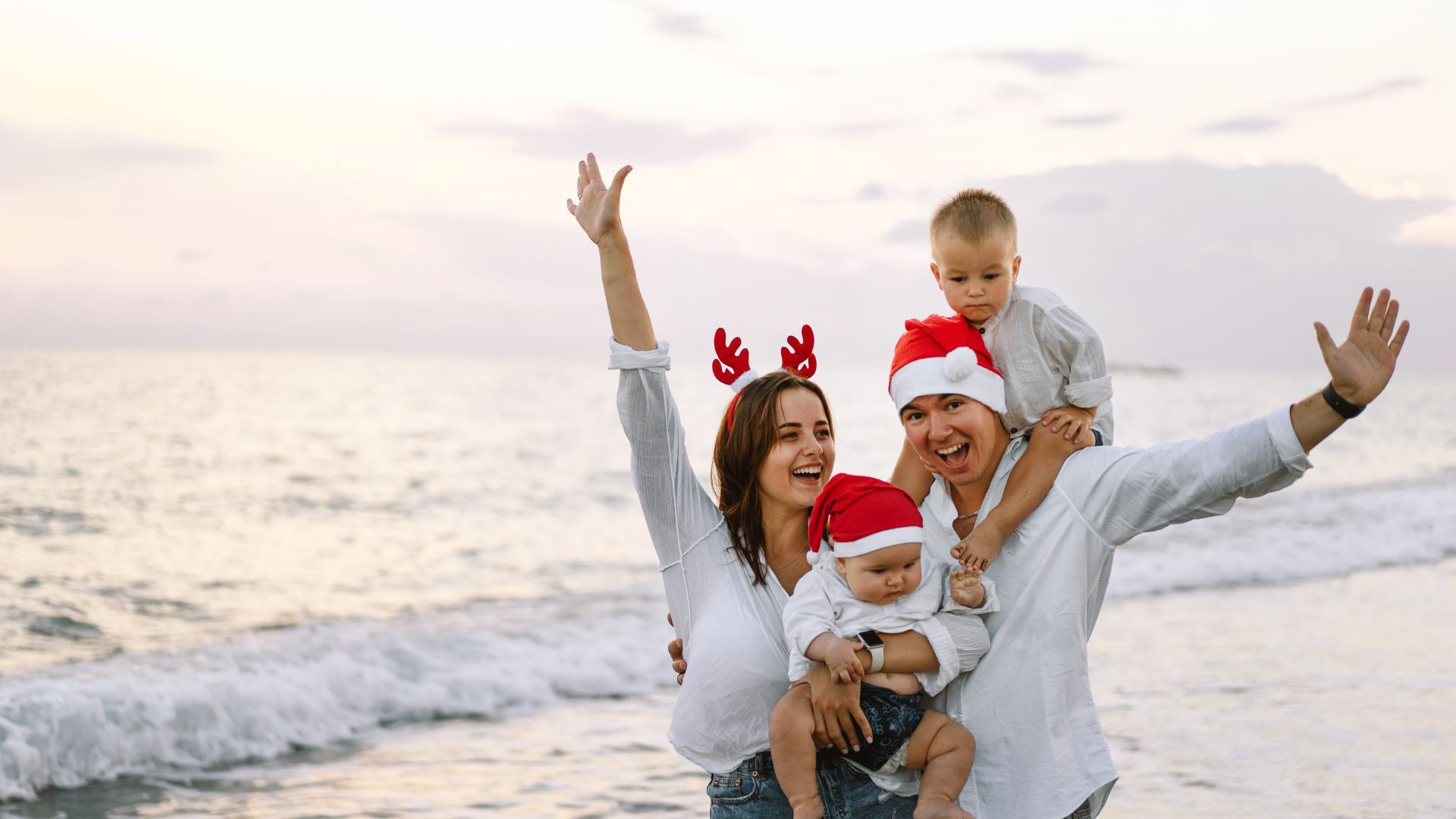 Family On The Beach Celebrating Christmas