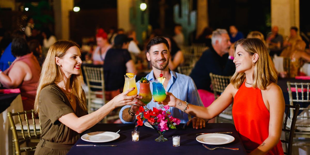 Friends toast to a delicious dinner at Villa del Palmar Los Cabos