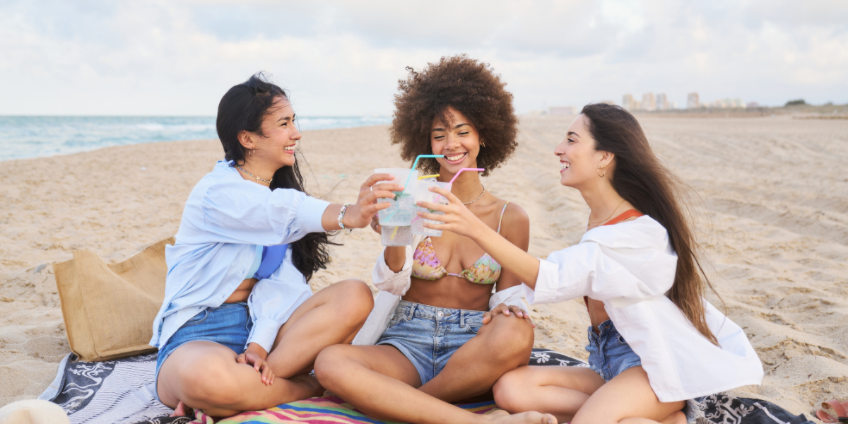 Group of friends enjoying a picnic on the beach