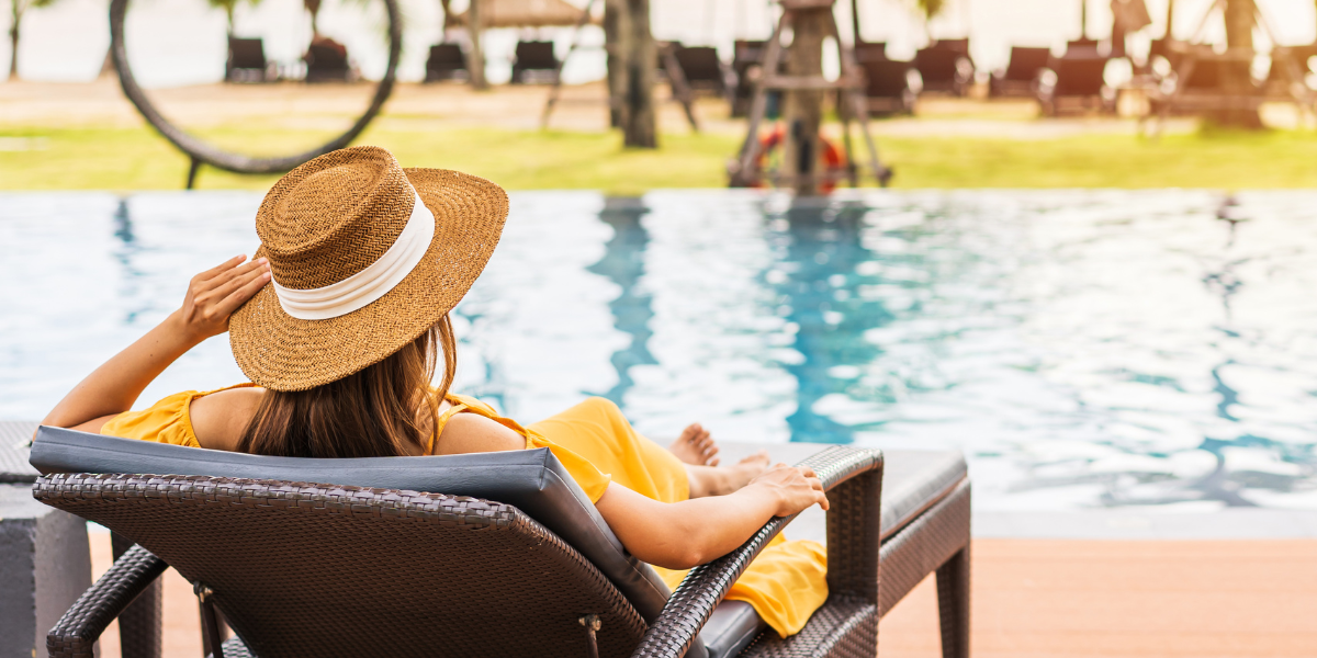 Young tourist enjoying a pool at a luxury resort