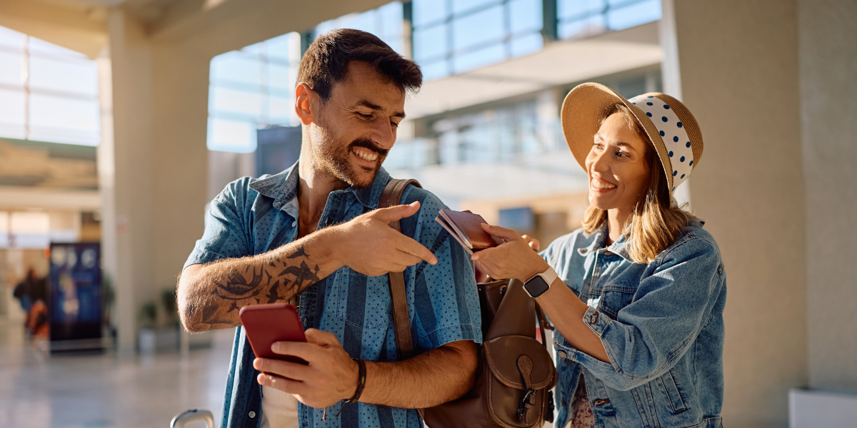 Smiling young couple at the airport