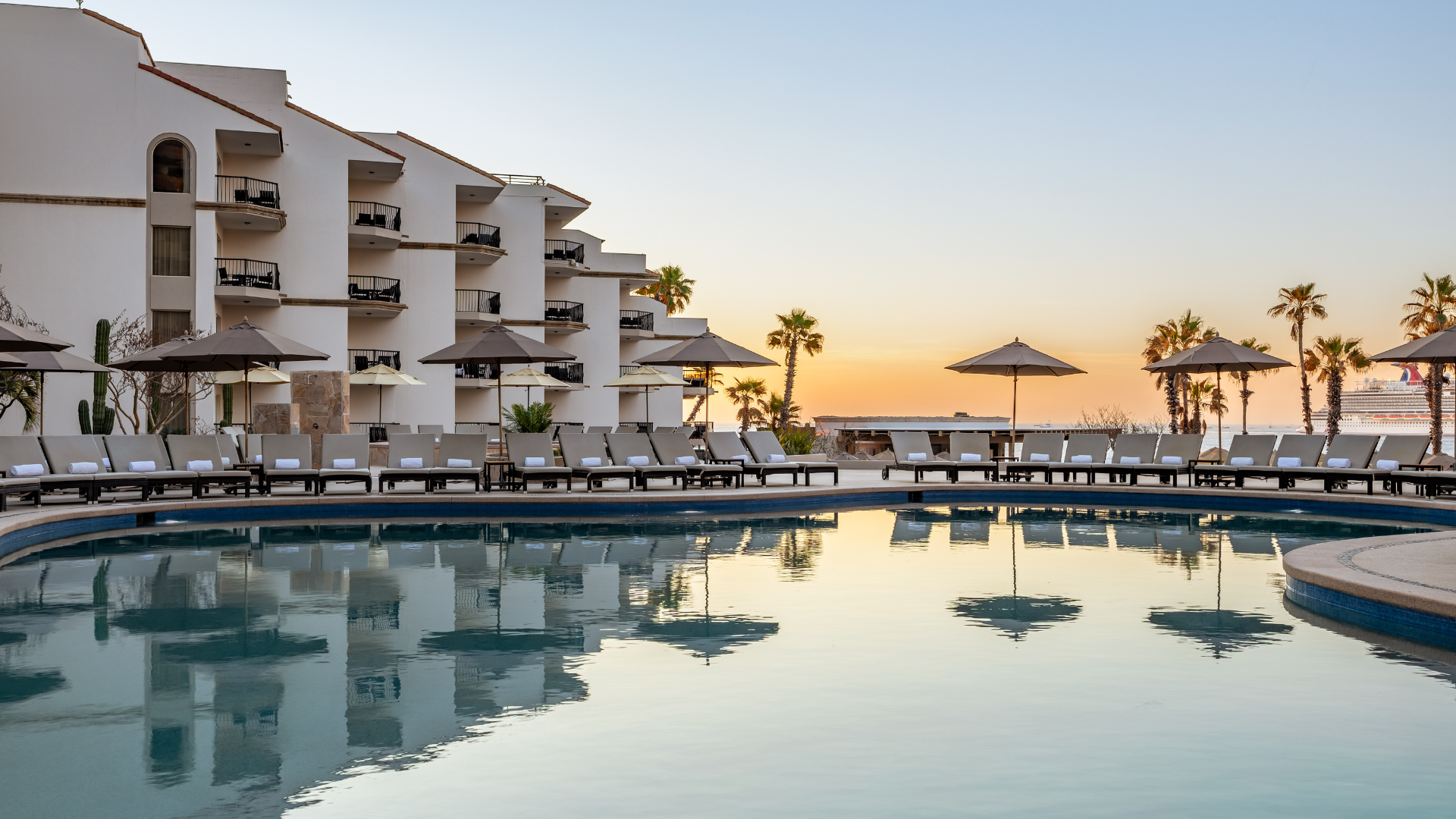 View of the pool at an all-inclusive hotel in Cabo overlooking the ocean