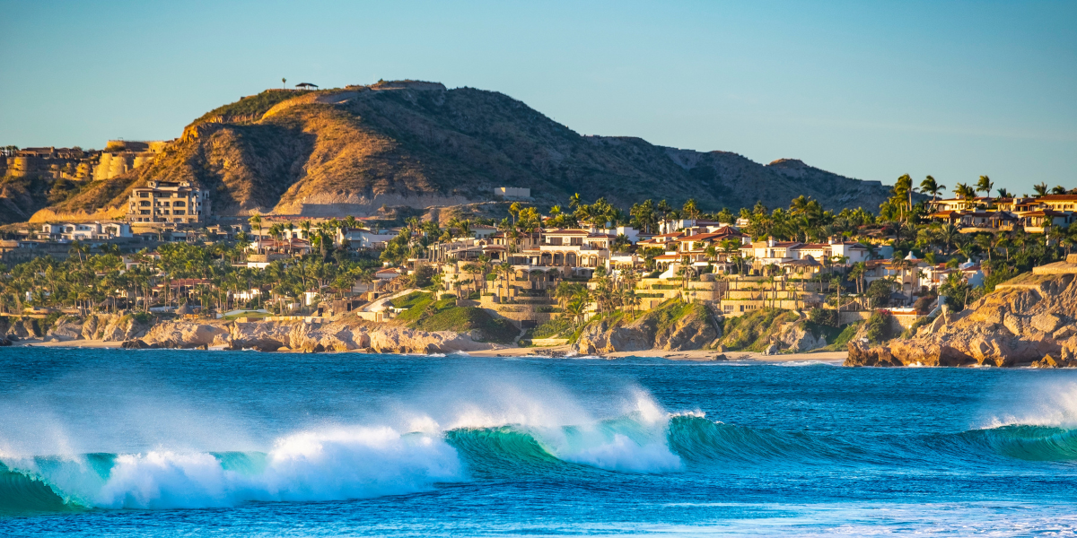 View from the sea of the resorts and mountains of Cabo San Lucas